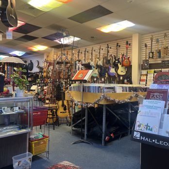Rossi Music Store: Tiendas de Instrumentos y Lecciones de Música en Español
